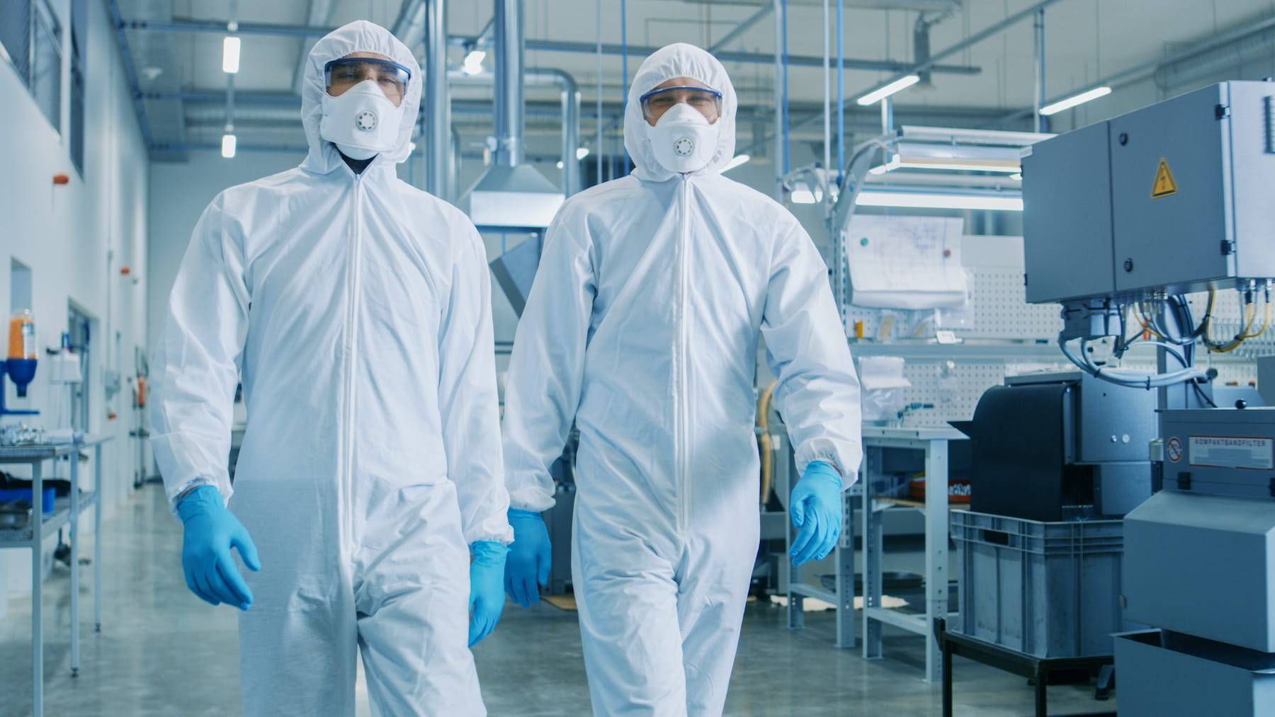 Two workers in a clean room